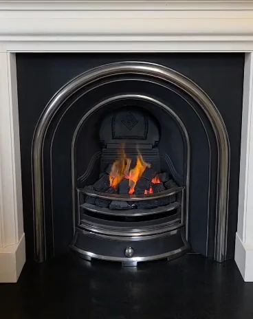 An arched fireplace setting