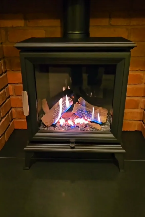A stove in a brick-lined opening