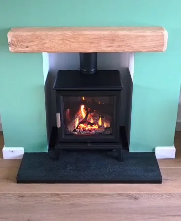 A stove beneath a timber beam
