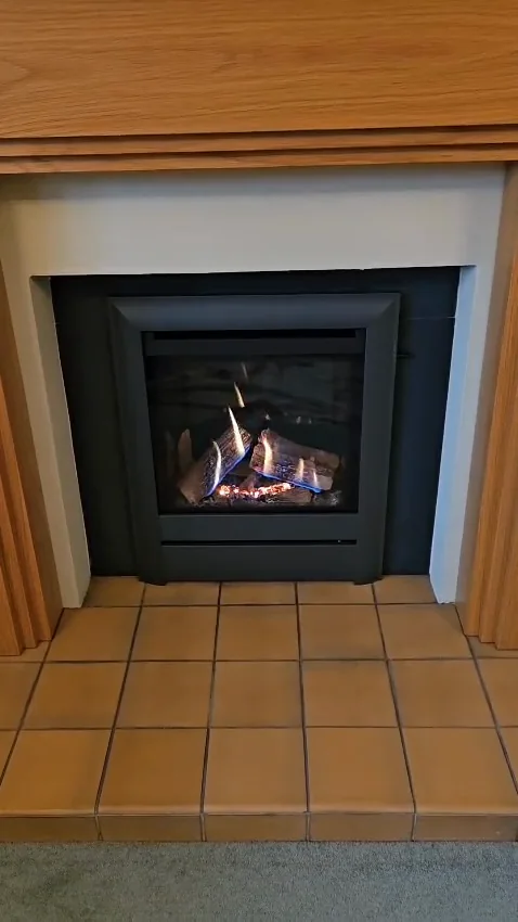 A timber surround and tiled hearth